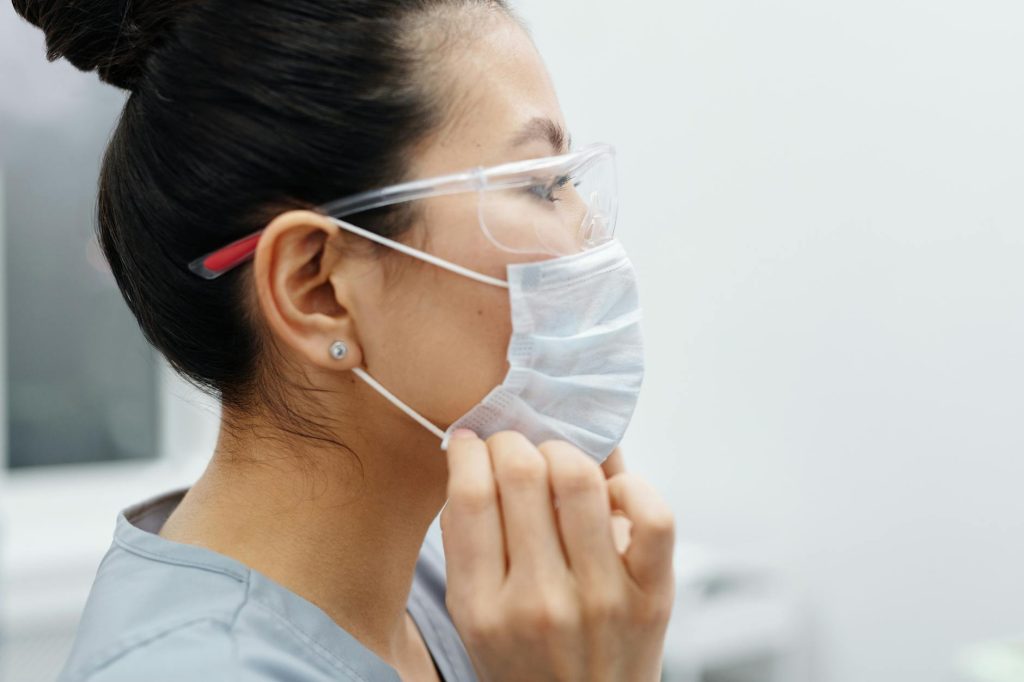 photo of woman wearing protective mask